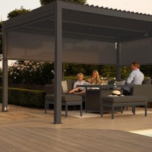 3m x 3m Freestanding Pergola with 4 Zip Sides & LED Lighting by Como with family seated under